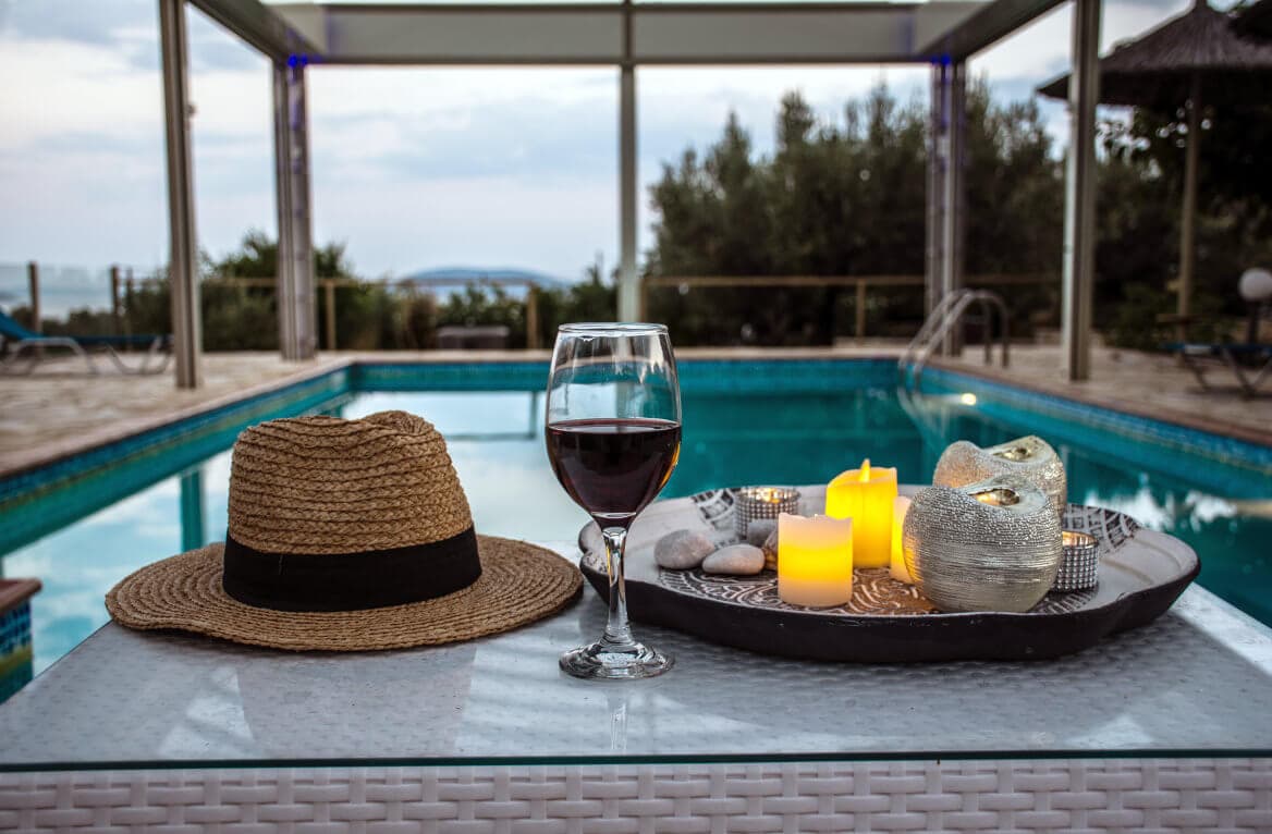 A glass of red as the light goes